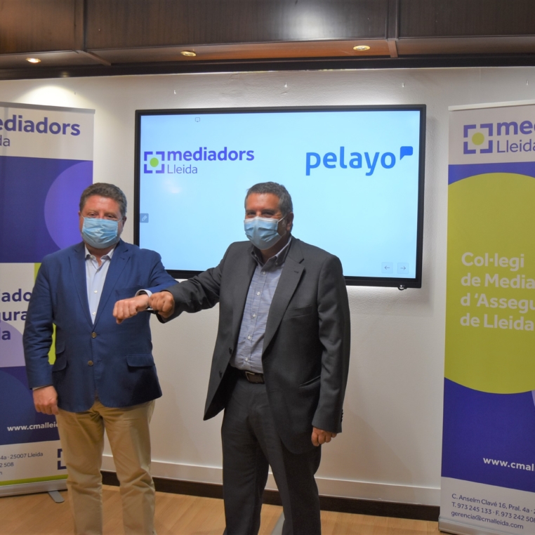 Firma convenio Colegio y Pelayo